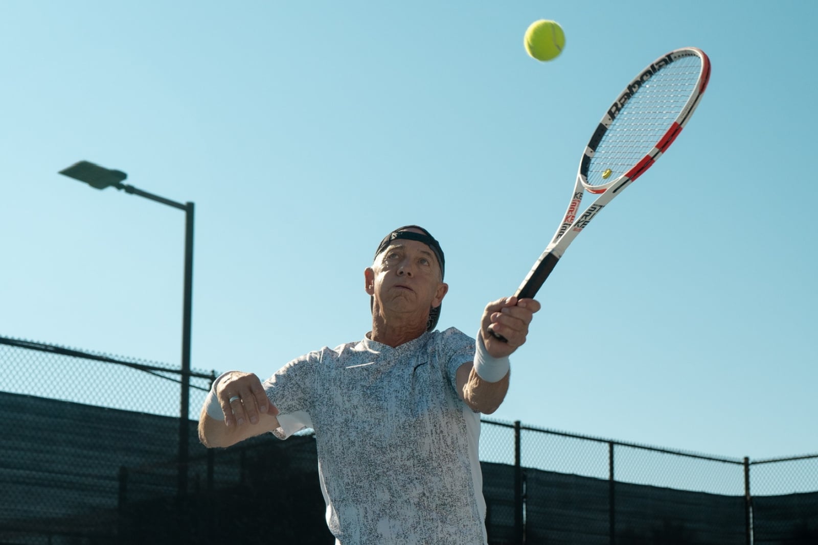 Beyond Beginner player hitting a serve at Laguna Beach Tennis Academy
