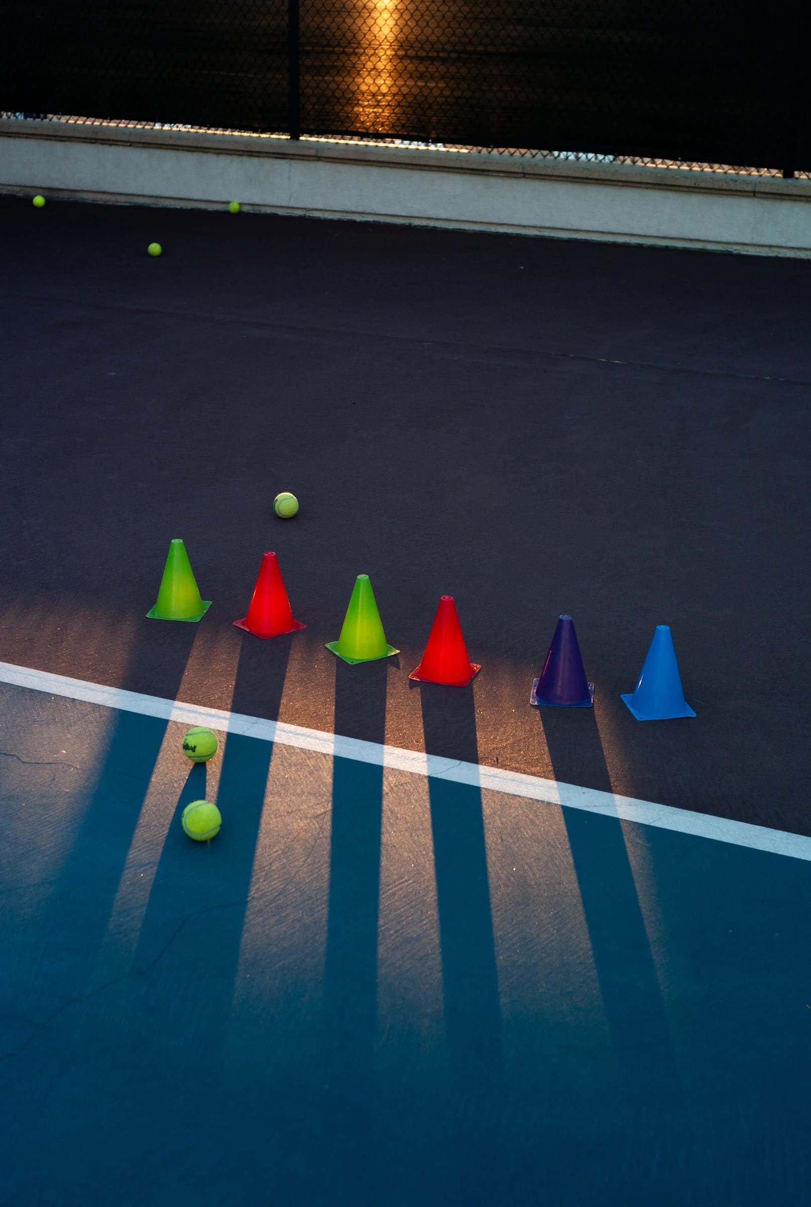 Alta Laguna tennis courts with shadows across the playing surface