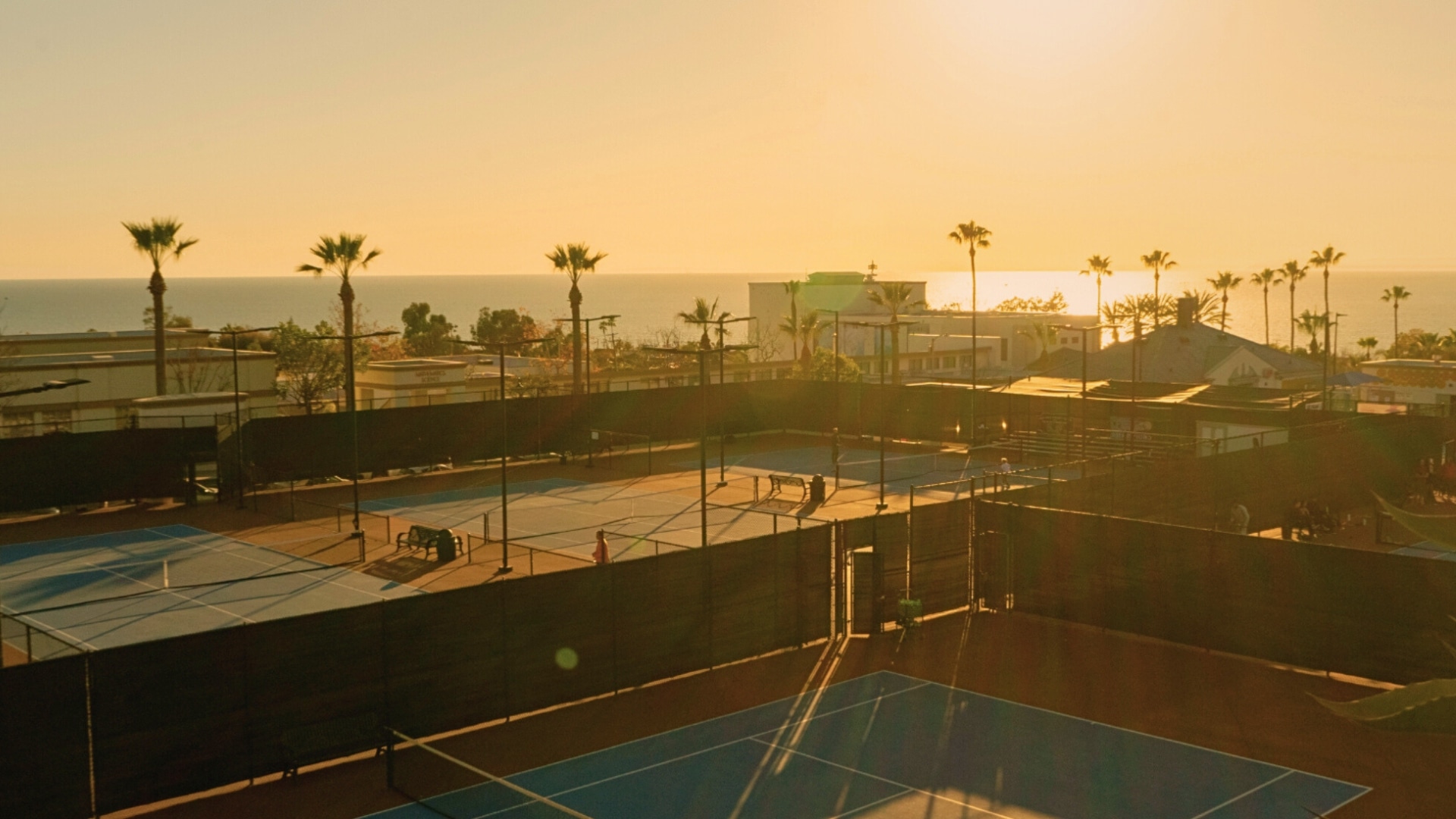 Coastal tennis courts at sunset — Laguna Beach training environment