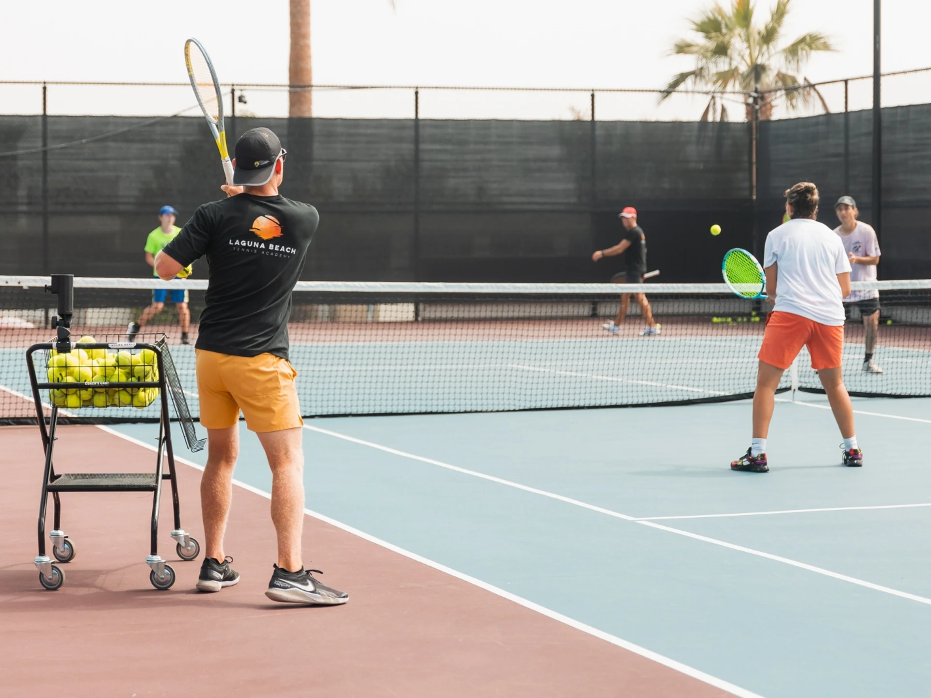 Coach and players during a LiveBall doubles session at LBTA