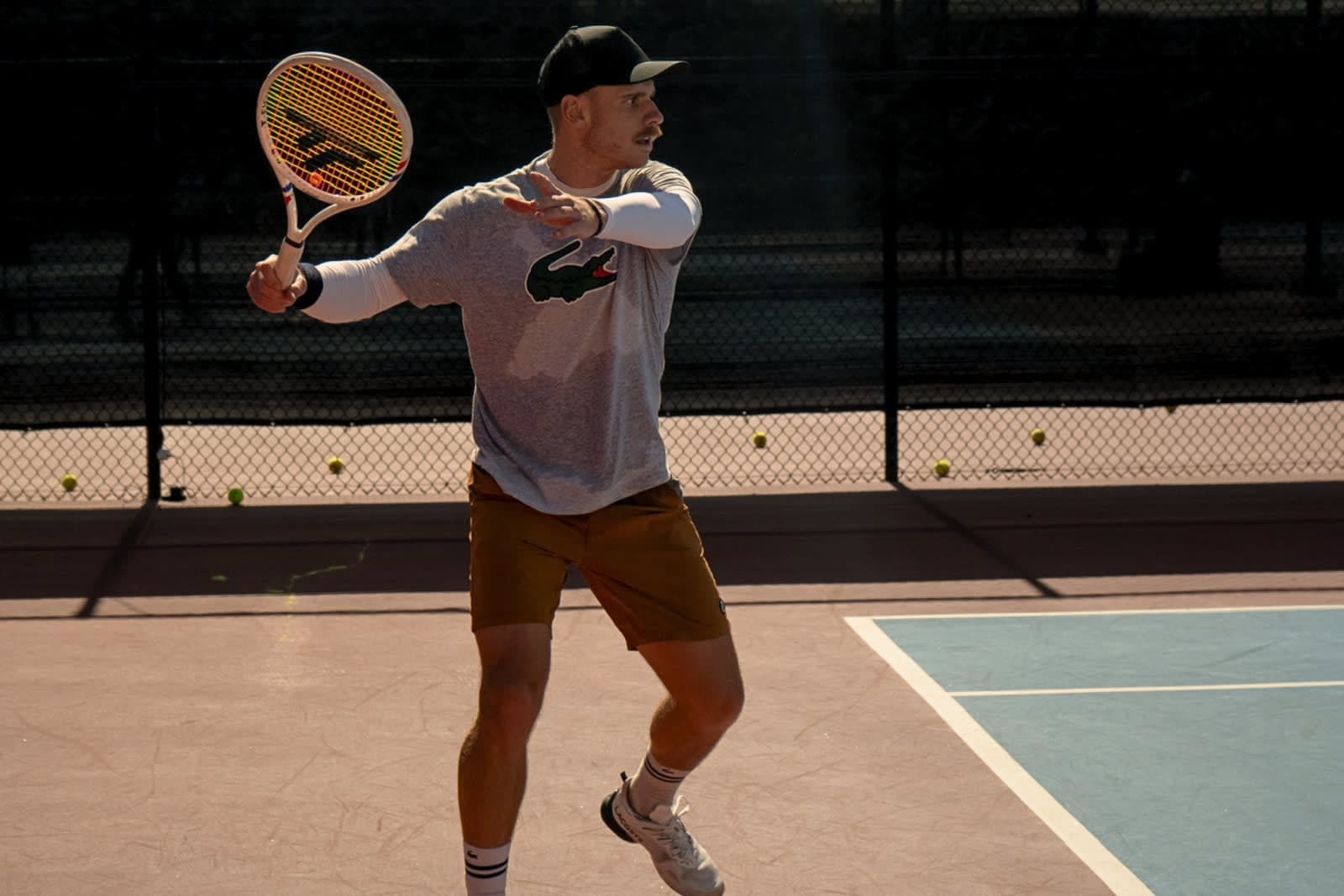 Karue Sell hitting a forehand on an outdoor court at LBTA