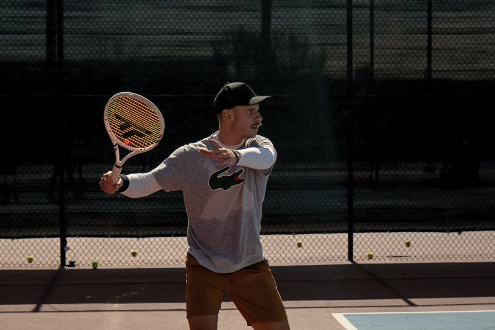 Karue Sell hitting a forehand on an outdoor court at LBTA