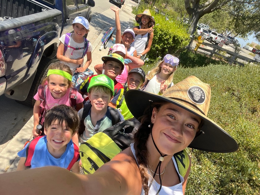 Campers celebrating team challenges during summer week